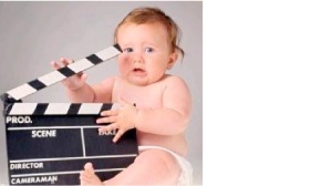 BABY WITH CLAPBOARD